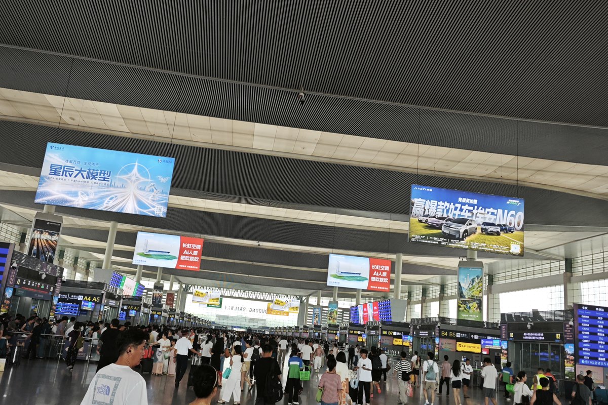 The departure concourse at Chengdu East, gate clusters lettered A and B beneath departure boards.