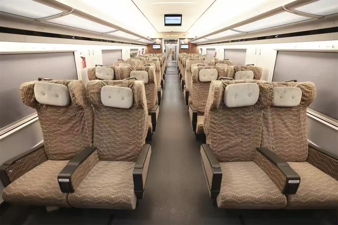 First-class cabin of a China high-speed train with 2 plus 2 reclining seats