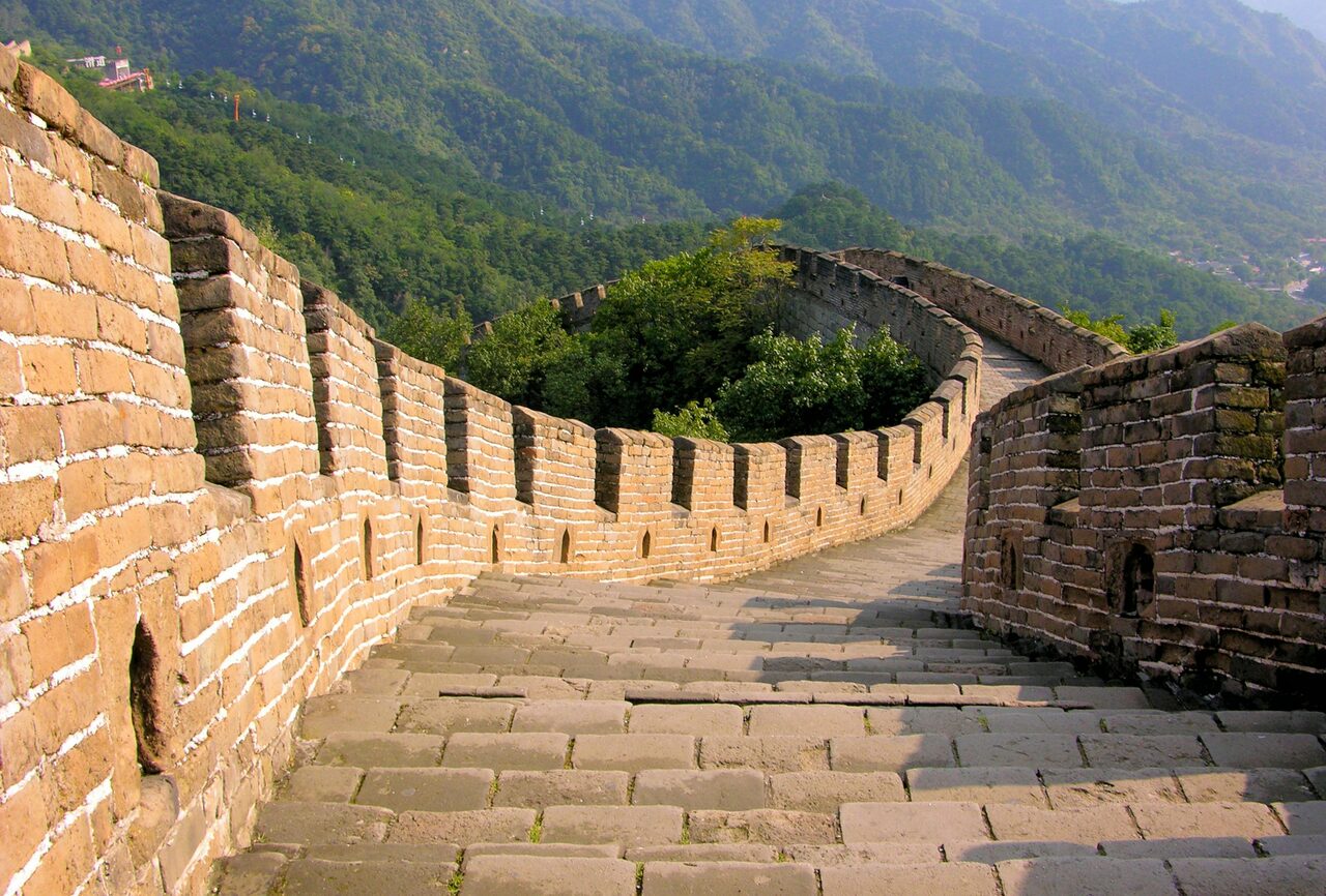 Jinshanling Great Wall section stretching across mountain ridges at sunrise, Beijing.