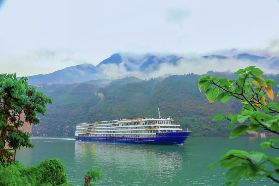 Three Gorges cruise ship sailing through the Yangtze River gorges, Chongqing.