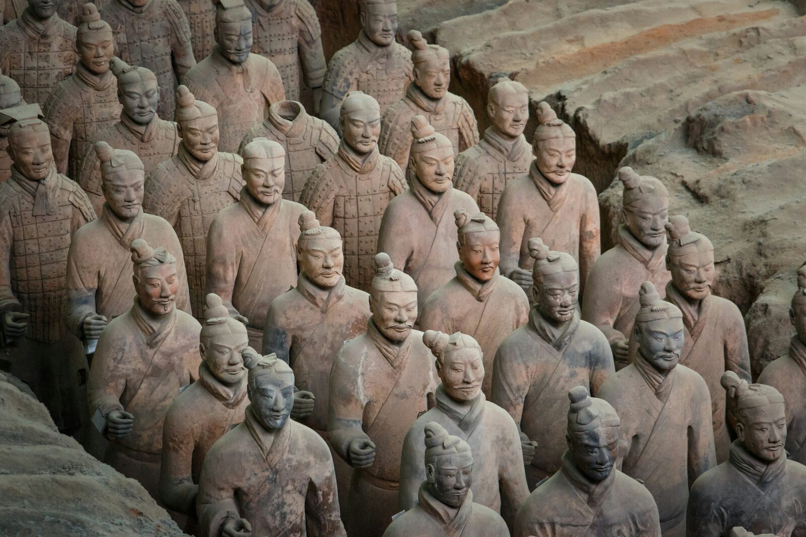 Rows of life-sized Terracotta Warriors at the excavation pit near Xi'an — 2,200 years old.