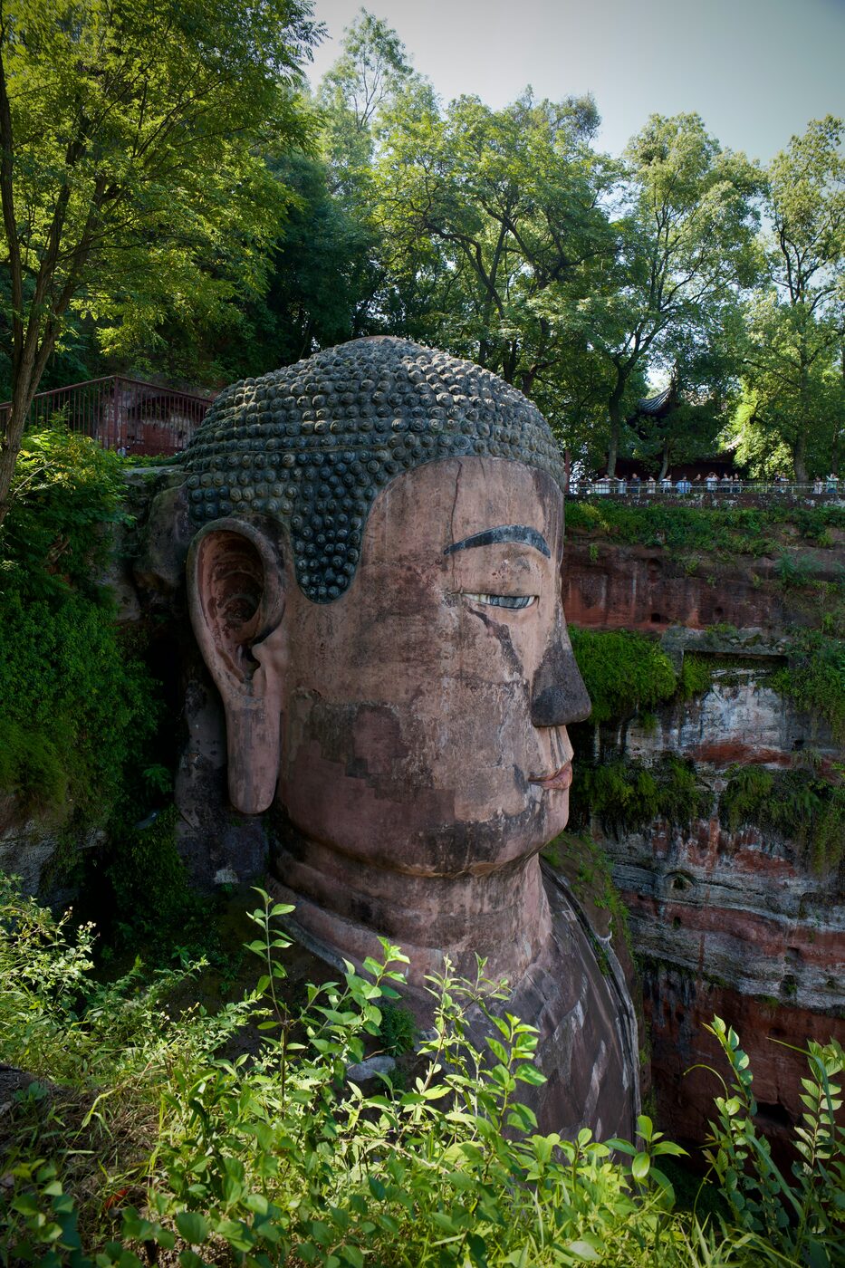 The Leshan Giant Buddha, a 71 m Tang-dynasty Buddha carved into the cliff at the river confluence, Sichuan.