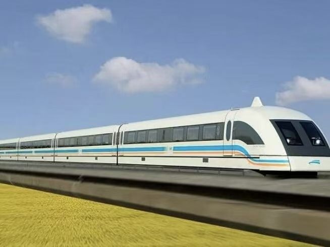 Shanghai Maglev train running at speed on the elevated track between Pudong Airport and Longyang Road, white body with blue accent stripe
