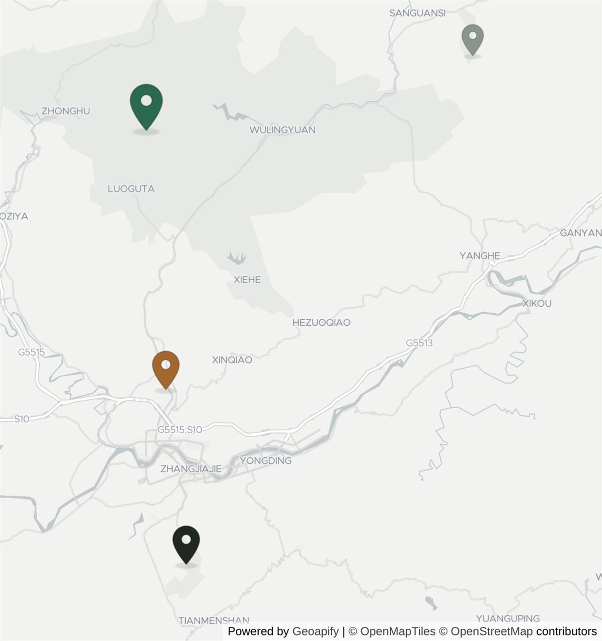 Map of the Zhangjiajie area. Zhangjiajie West railway station sits in the middle. Tianmen Mountain is about 13.4 km south of it, inside the city and next to the old central station. The national forest park at Wulingyuan is about 19.6 km north of the station in the other direction. The Grand Canyon glass bridge is further north-east again, roughly 34.3 km from the station and 25.3 km from the park.