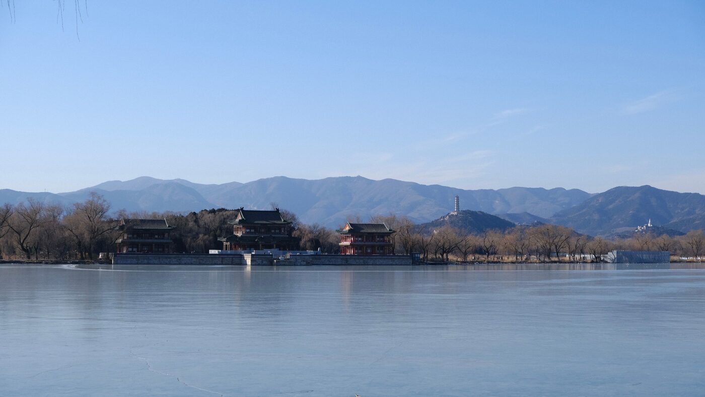 Imperial garden architecture and the wooded slope of Longevity Hill above Kunming Lake at the Summer Palace, Beijing.